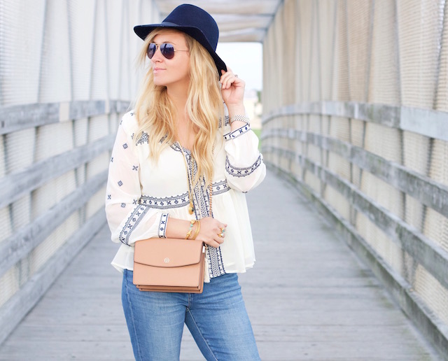 Orange County fashion blogger Nikki Prendergast of My Style Diaries in boyfriend jeans and a boho peasant top.