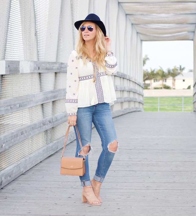 Orange County fashion blogger Nikki Prendergast of My Style Diaries in boyfriend jeans and a boho peasant top.