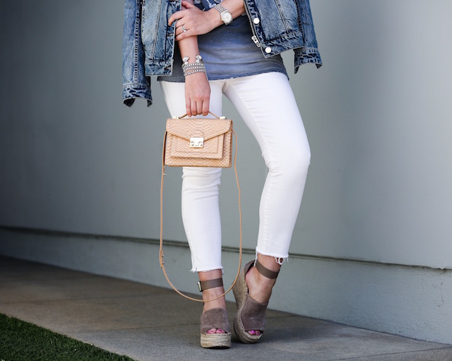 Orange County fashion blogger Nikki Prendergast of My Style Diaries wears a Junk Food Clothing tank, white jeans, Loeffler Randall handbag, Marc Fisher wedges, for festival season style.