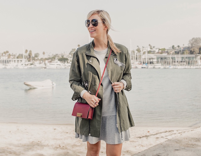 Fashion and lifestyle blogger Nikki Prendergast of My Style Diaries in the cabi Flashdance dress and Hanson Anorak with Nike sneakers.