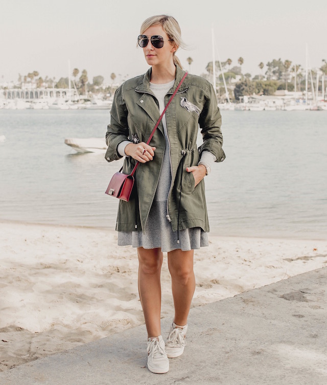 Fashion and lifestyle blogger Nikki Prendergast of My Style Diaries in the cabi Flashdance dress and Hanson Anorak with Nike sneakers.
