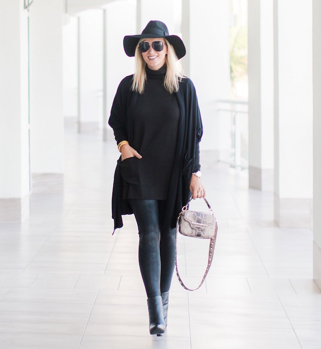 Fashion blogger Nikki Prendergast of My Style Diaries in Spanx leggings, cabi turtleneck and booties, and a Henri Bendel handbag.