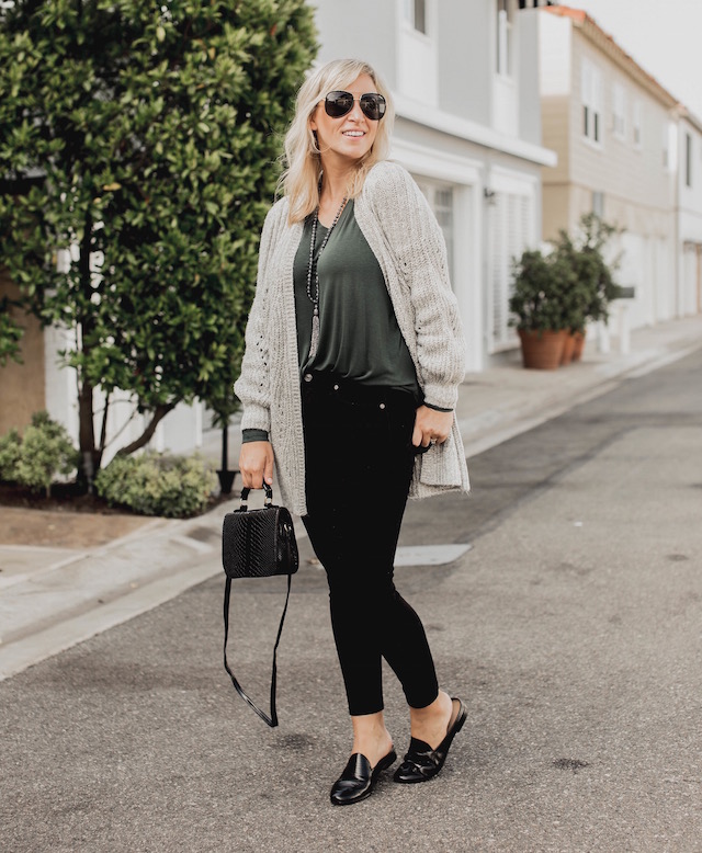 Fashion and lifestyle blogger Nikki Prendergast of My Style Diaries in Banana Republic skinny jeans and loafers and an oversized cabi cardigan.