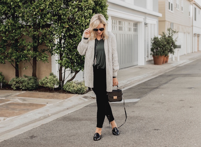 Fashion and lifestyle blogger Nikki Prendergast of My Style Diaries in Banana Republic skinny jeans and loafers and an oversized cabi cardigan.