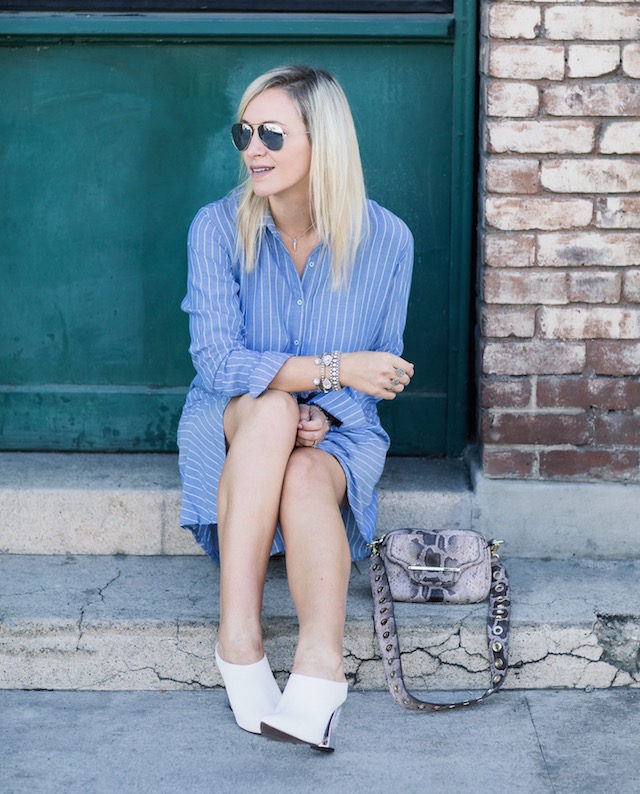 Fashion blogger Nikki Prendergast of My Style Diaries in Who What Wear white mules with a Henri Bendel handbag.