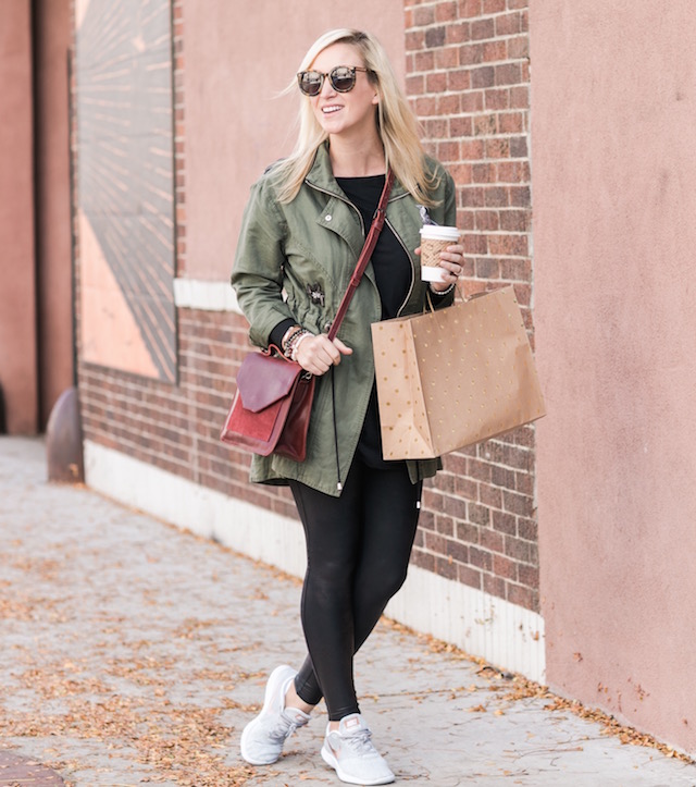 Spanx faux leather leggings, cabi jacket, crossbody bag, and Nike sneakers from Famous Footwear