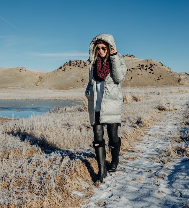 Carve Designs coat, Hunter boots, Free People scarf and hat, cold weather essentials in the National Elk Refuge in Jackson Hole, Wyoming.