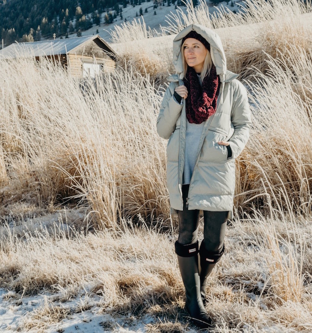 Carve Designs coat, Hunter boots, Free People scarf and hat, cold weather essentials in the National Elk Refuge in Jackson Hole, Wyoming.