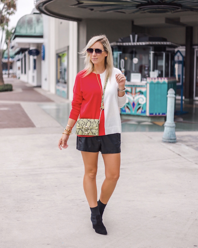 Leather shorts, sock booties, colorblocked sweater | My Style Diaries blogger Nikki Prendergast